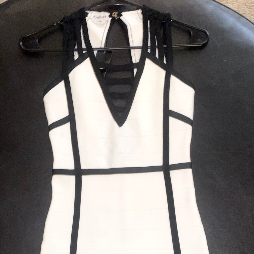 Extra small beautiful and super sexy Bebe dress with tags attached. ❤️
